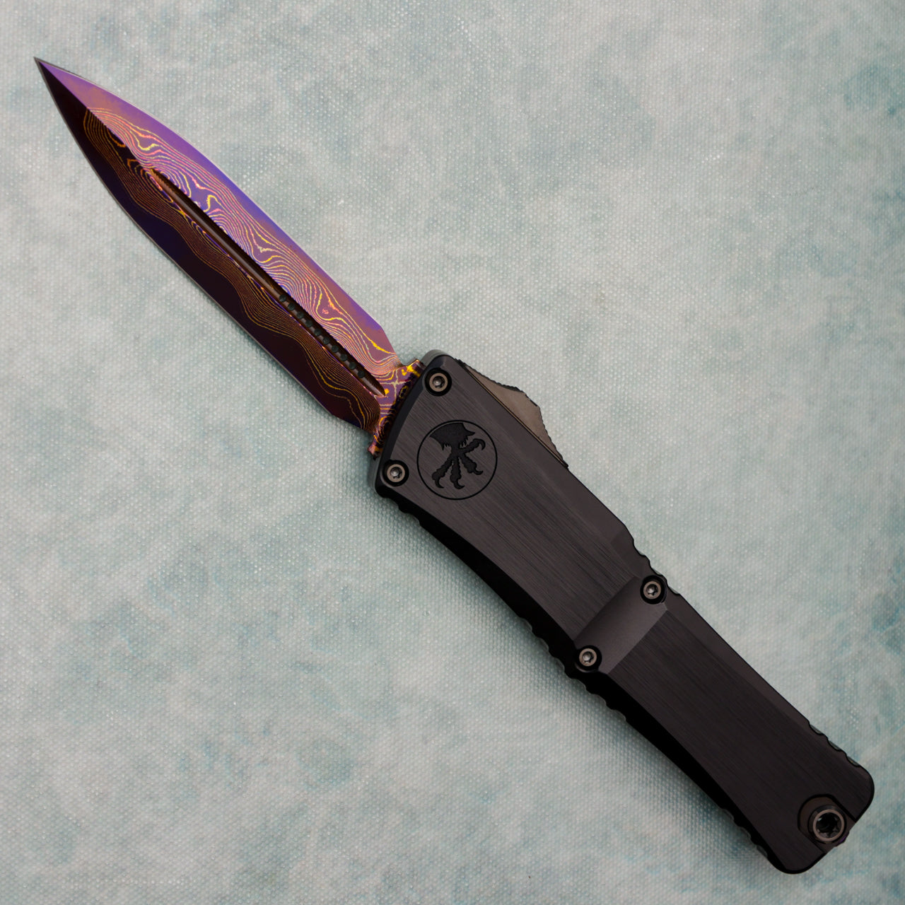 Microtech Marfione Select Combat Troodon LT Gen III D/E Hefted Alloy Blued Baker Forge Coppermai Damascus Purple Haze Accent 1142-16MS3
