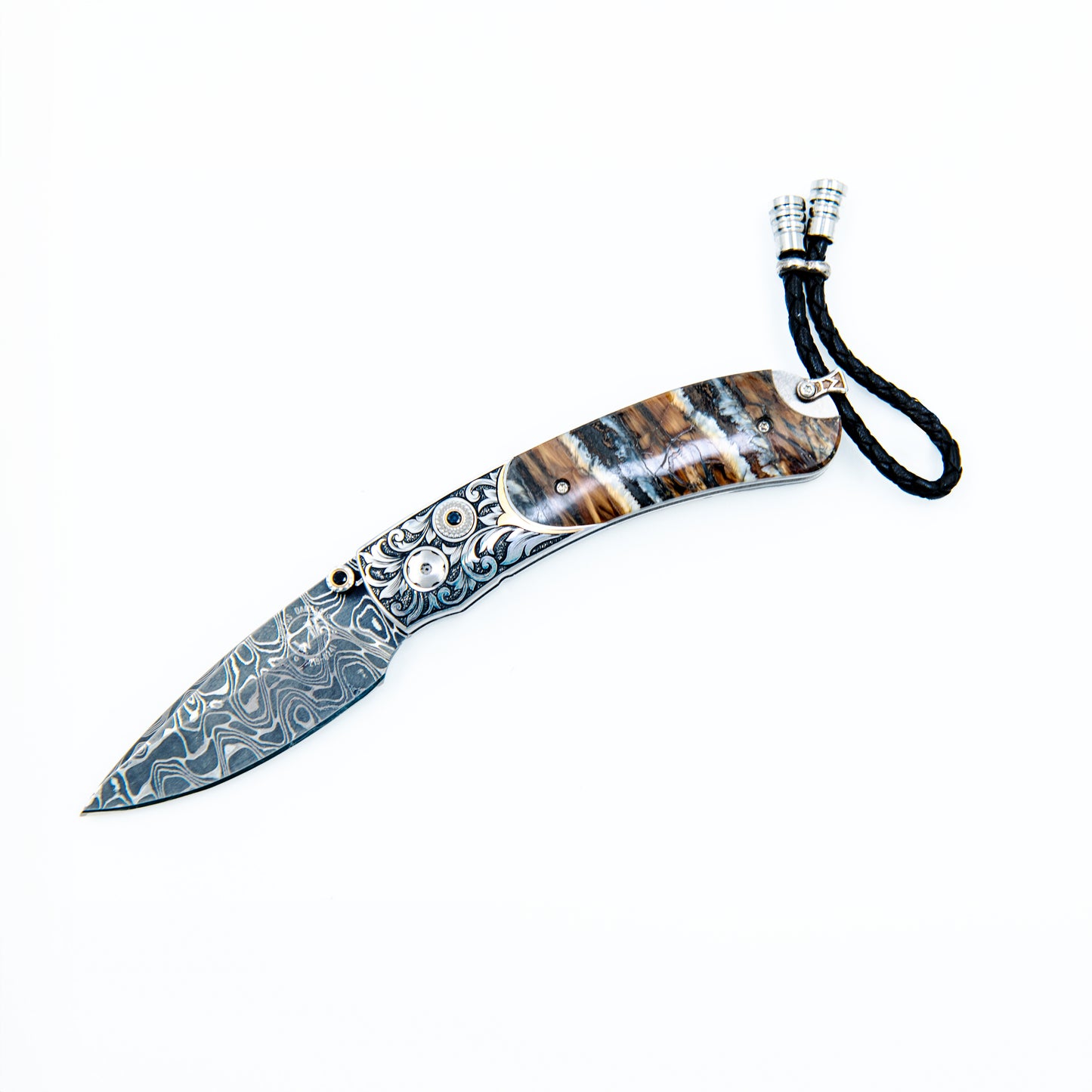 WILLIAM HENR Y The Kestrel ' features beautiful hand-engraved handles with 24K gold inlays