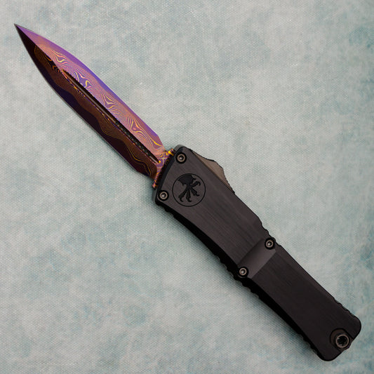 Microtech Marfione Select Combat Troodon LT Gen III D/E Hefted Alloy Blued Baker Forge Coppermai Damascus Purple Haze Accent 1142-16MS3