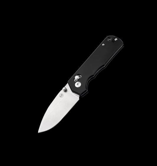 A folding pocket knife with a black handle and a silver stainless steel blade, shown open against a solid black background.