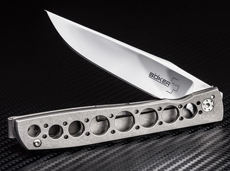 Folding knife with a unique handle design on a black background