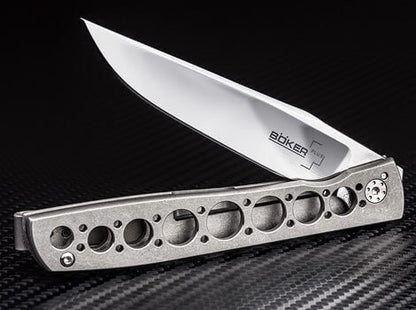 Folding knife with a unique handle design on a black background