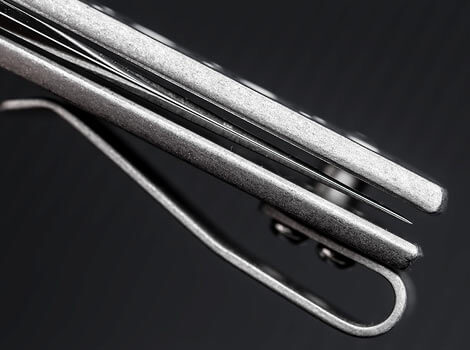 Close-up of metal utensils on a dark background