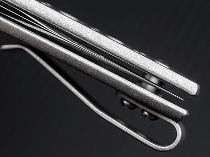 Close-up of metal utensils on a dark background