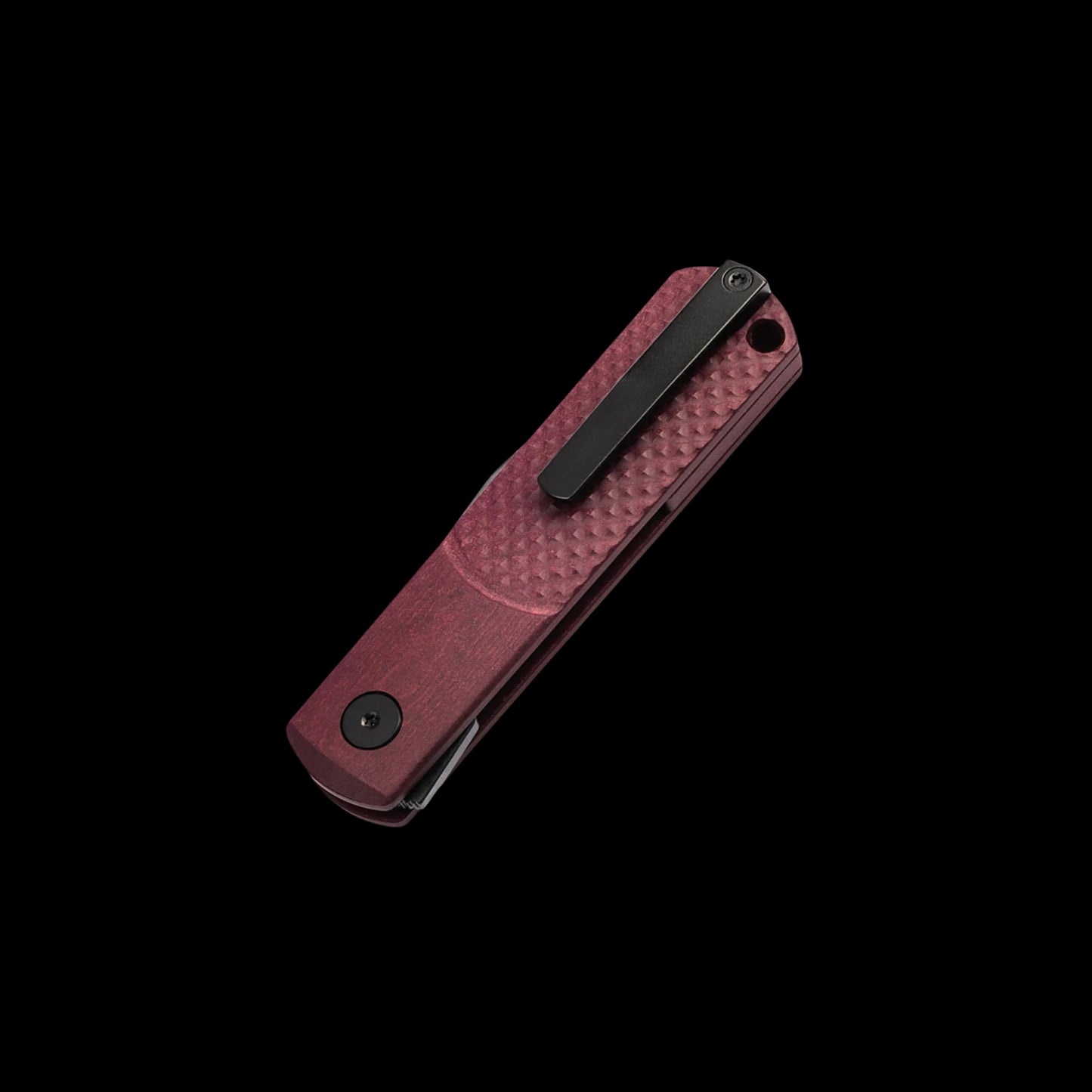 A pocket knife with a textured reddish-brown handle and a black clip, shown diagonally on a solid black background.