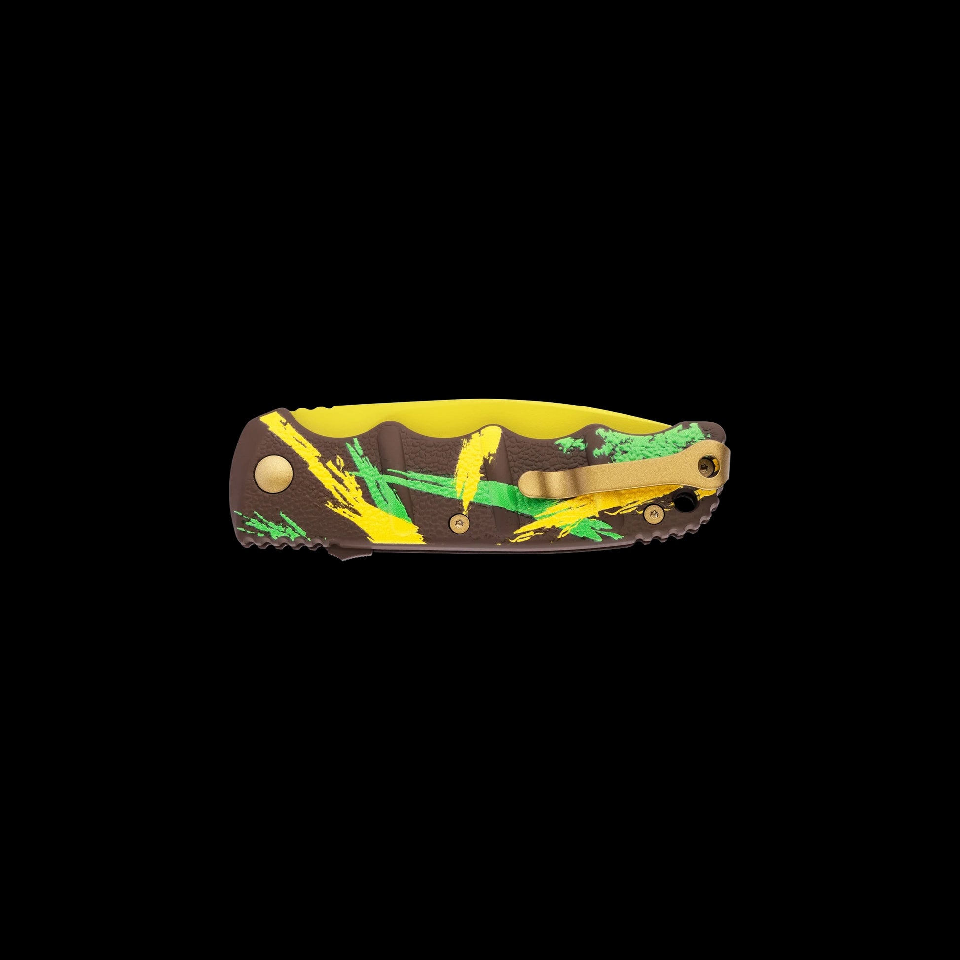 A folding pocket knife with a brown camouflage-style handle featuring yellow and green brushstroke patterns, a gold pocket clip, and a yellow inner scale, shown against a solid black background.