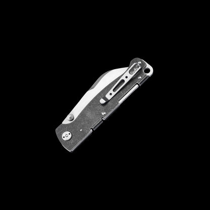 A folding pocket knife with a textured dark gray handle and a silver clip-point blade, shown open against a solid black background.
