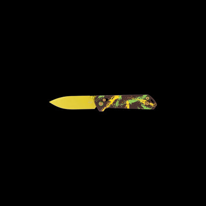 A folding pocket knife with a bright yellow blade and a marbled handle featuring green, yellow, and black swirls on a dark base, shown against a solid black background.