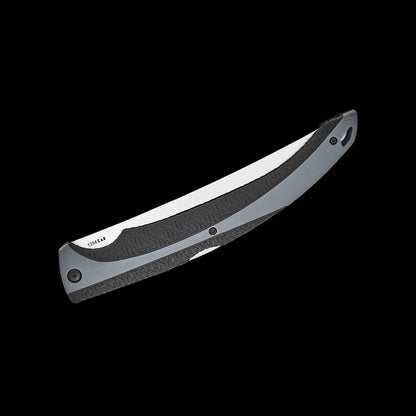 A folding pocket knife with a satin-finished silver blade and a textured black handle, shown diagonally against a solid black background.