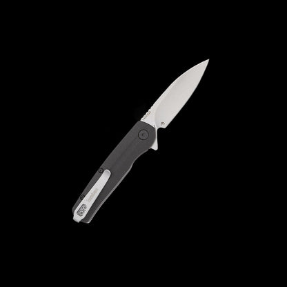 A folding pocket knife with a satin-finished silver blade and a textured black handle, shown open against a solid black background.