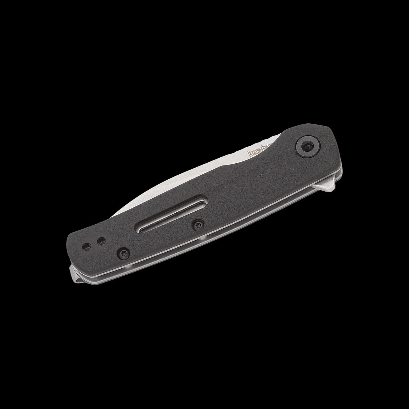 A folding pocket knife with a black textured handle and a silver metal blade, shown open against a solid black background.